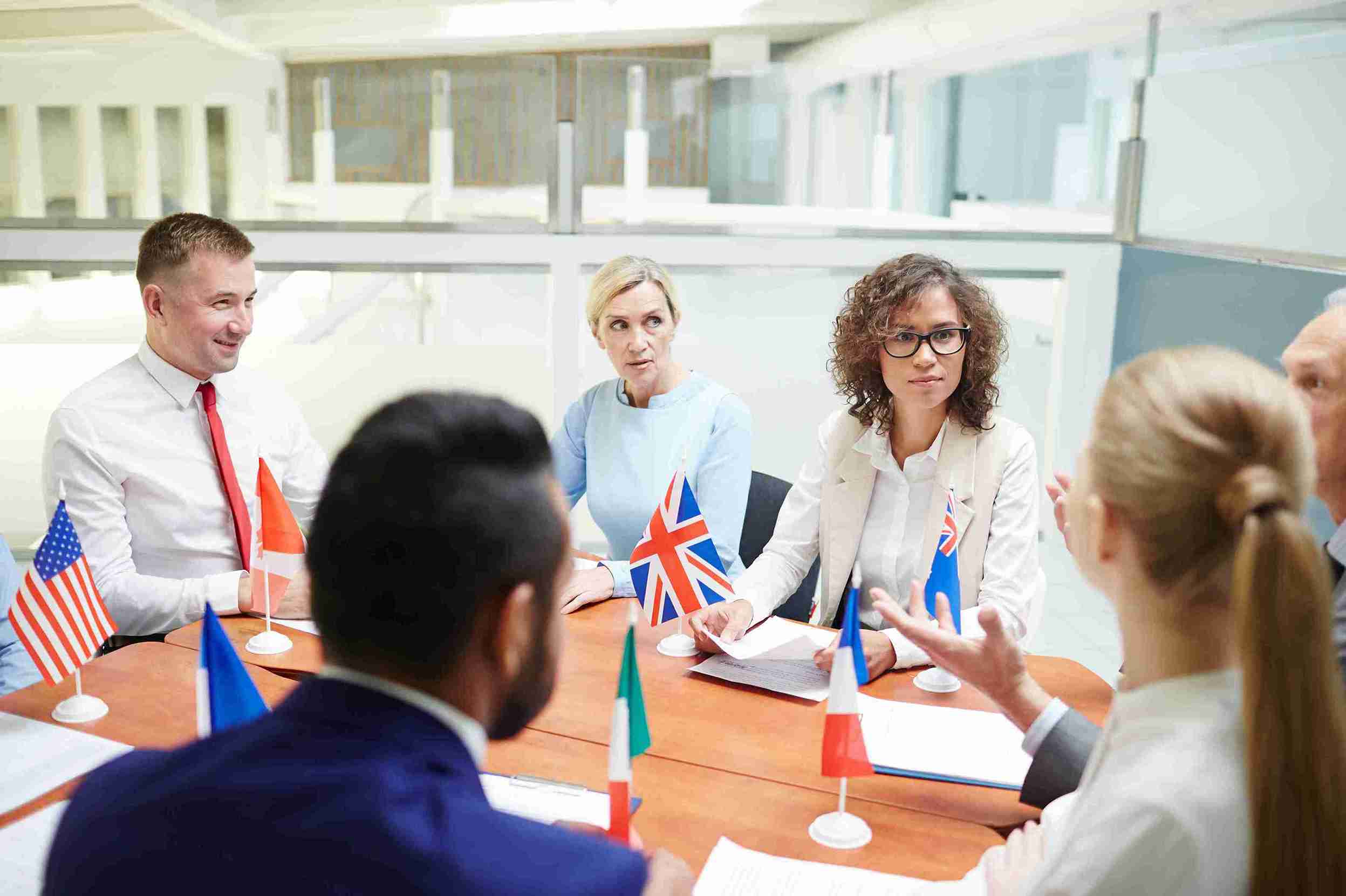 international-corporate-business-meeting-with-flag