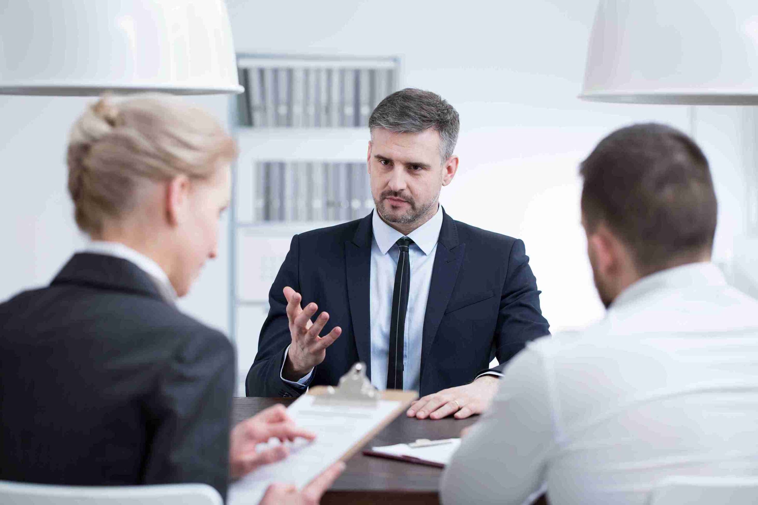 business-meeting-with-team-around-dark-table