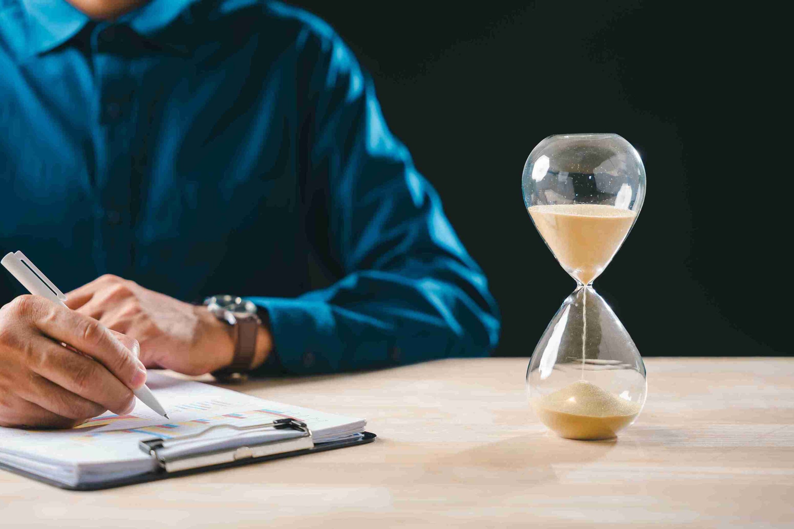 hourglass-chart-pen-man-and-time-concept