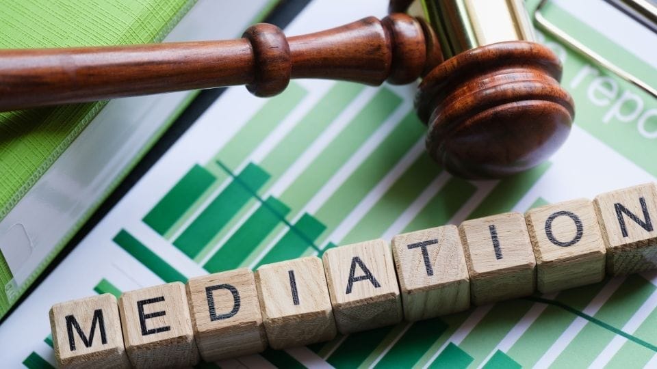 (An image can be seen to consider mediation before going to the court )