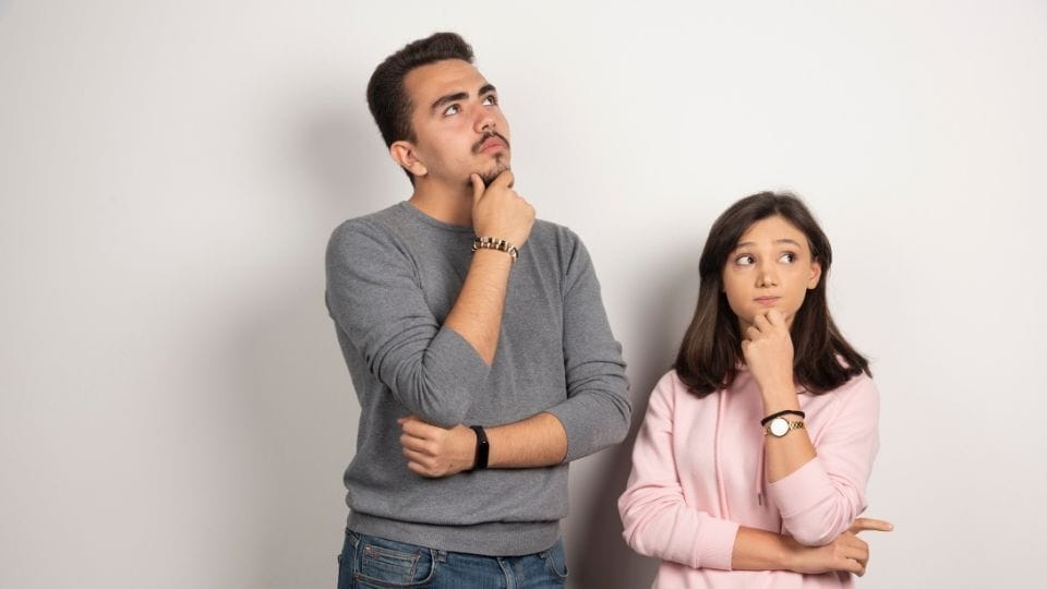 (A couple can be seen wondering how to apply for spouse visa extension)