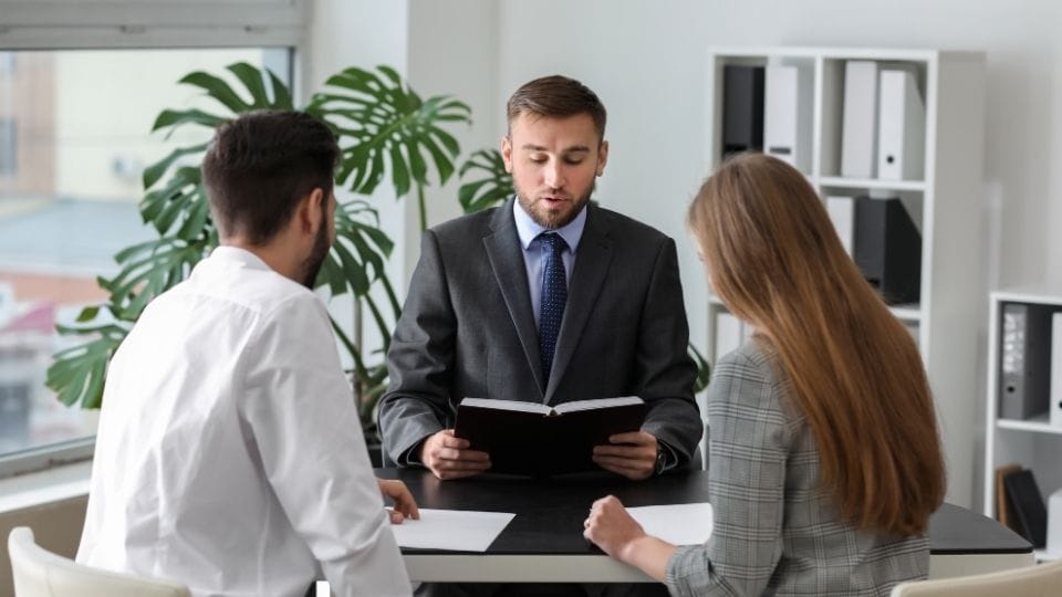 (In the image a solicitor can be seen guiding the unmarried couple)