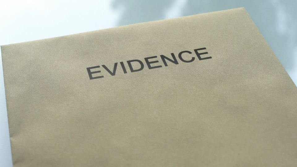 (An image can be seen of confidential document labeled as evidence)