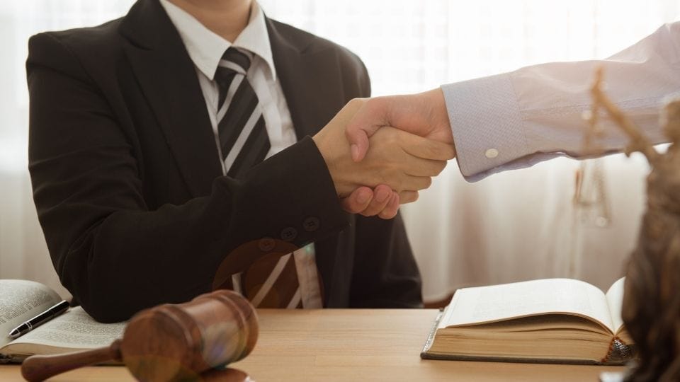 (A person can be seen taking legal advice from a professional solicitor)