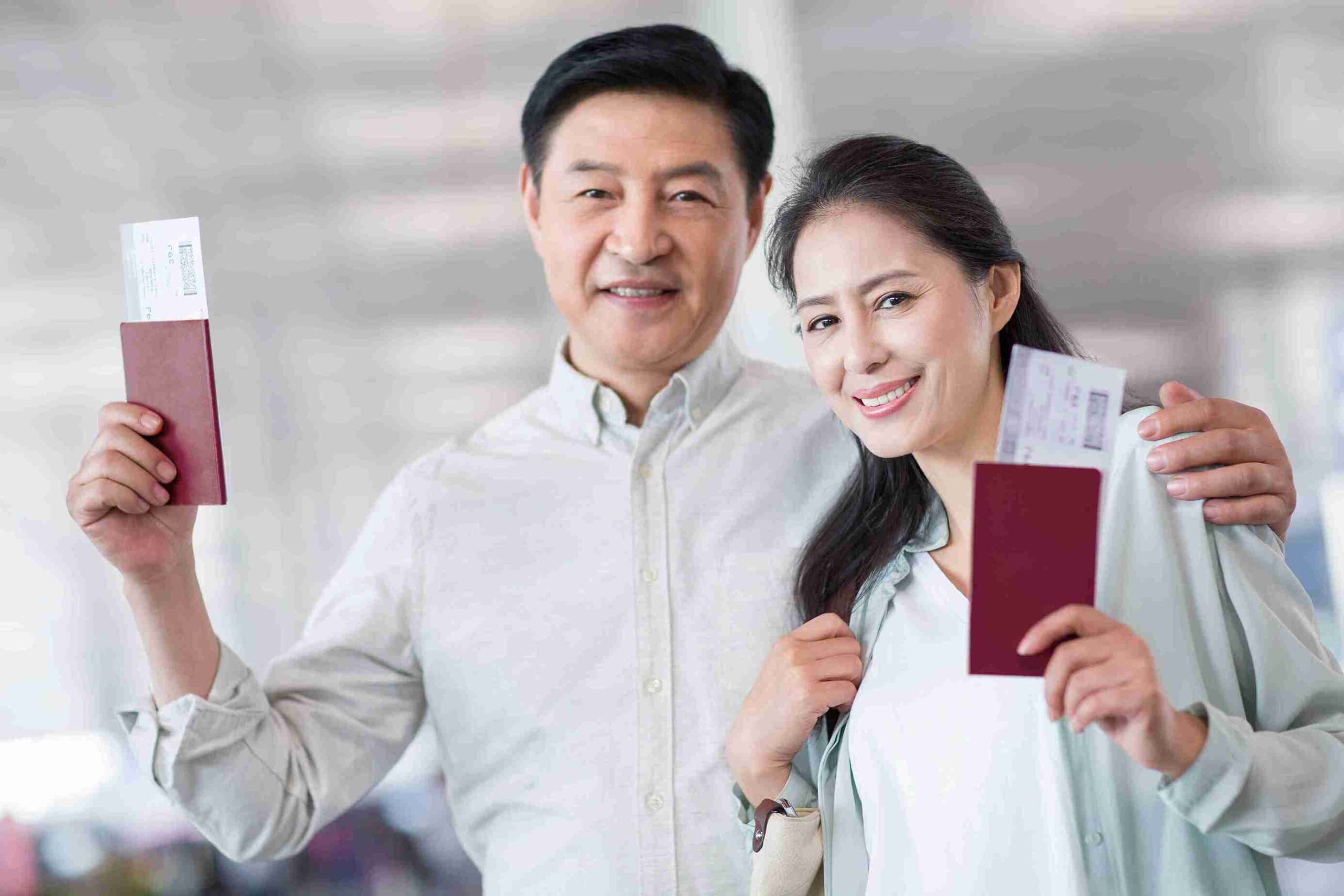 happy-couple-holds-passports-ready-to-travel