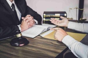 A will executor can be seen in the image holding a checklist