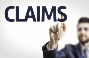 In the image it can be seen a document having the word claim on them) Legal Definition of an Adverse Possession Claim in the UK