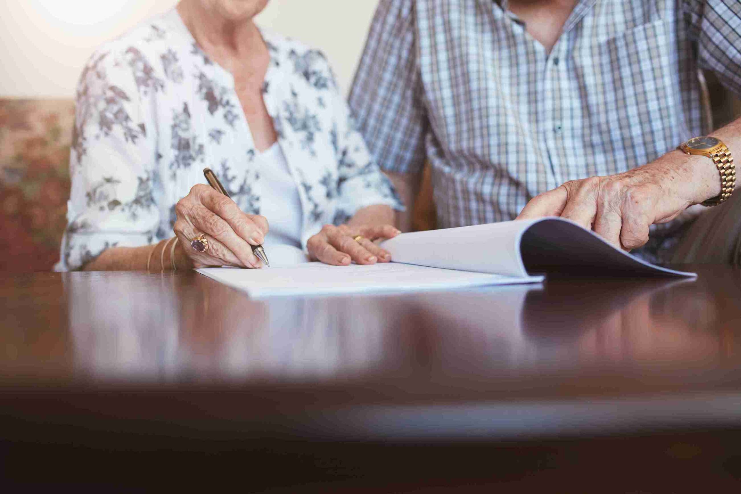You can see two different people, one working on a will and the other on a living trust document (Living Trust vs Will What are the Key Differences)