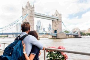 In the image a couple can be seen having a UK visa and tickets in their hand. What is the Unmarried Partner Visa UK Success Rate in 2025