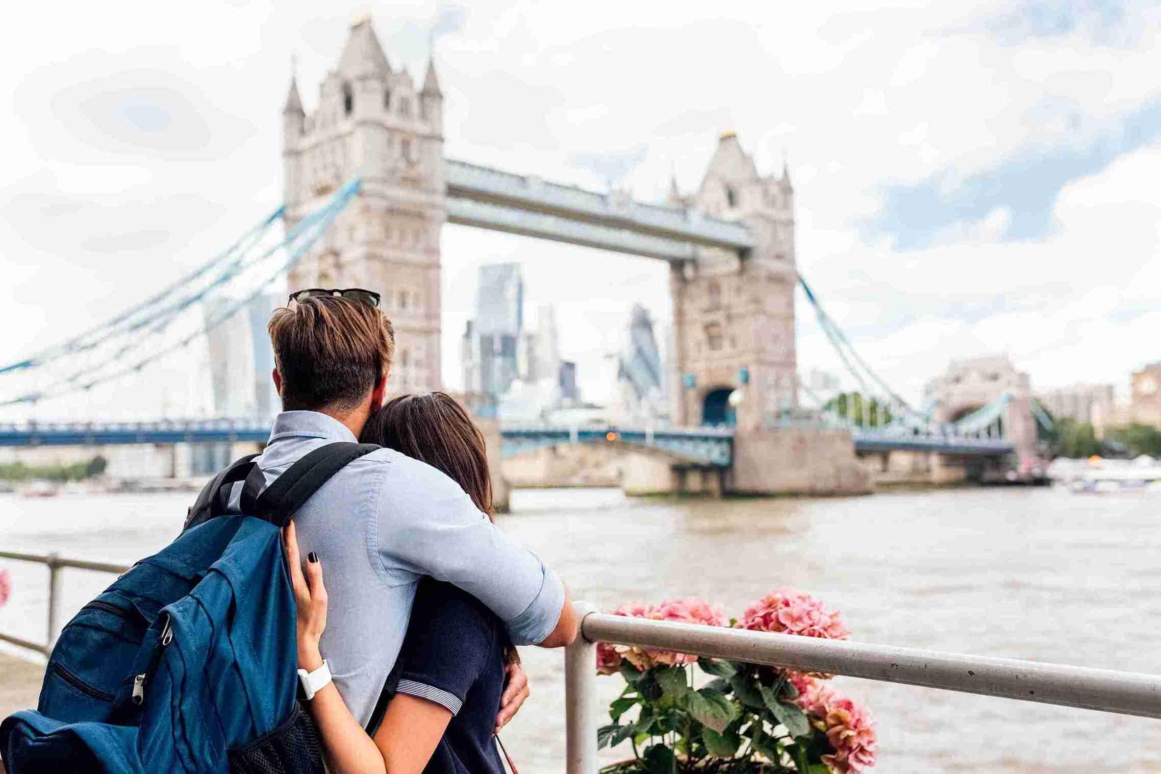 In the image a couple can be seen having a UK visa and tickets in their hand. What is the Unmarried Partner Visa UK Success Rate in 2025