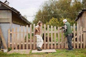 In the image it can be seen that two neighbours have a dispute on something and are arguing. Common Neighbour Disputes
