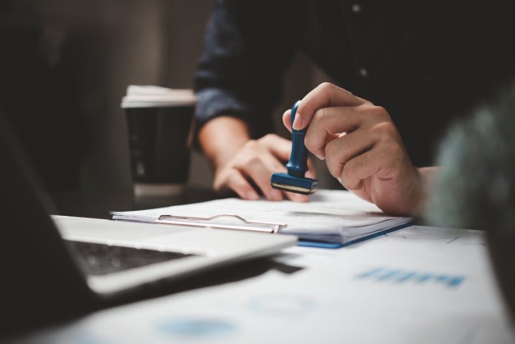 A person is actively writing on paper with a pen, capturing thoughts or ideas in written form.
UK visa refusal appeal