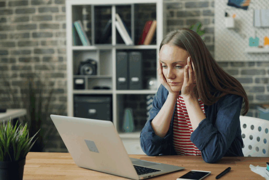 (A woman at a desk, resting her head in her hands, appears stressed or overwhelmed by her work.)
White-Collar Crime Law UK