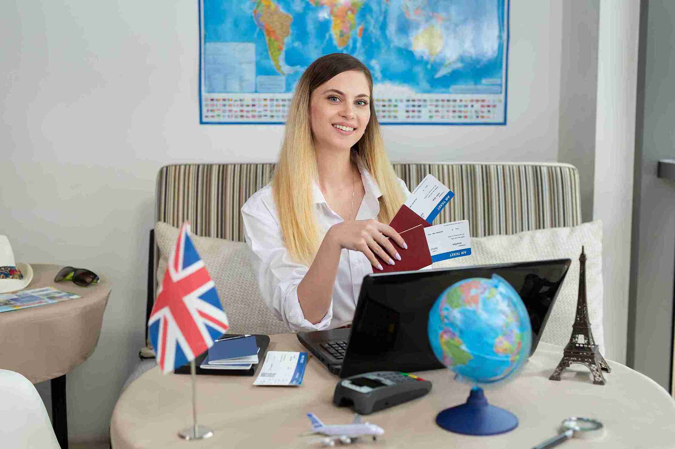 This image represents the idea of self sponsorship visa UK as you can see a girl pointing at UK flag