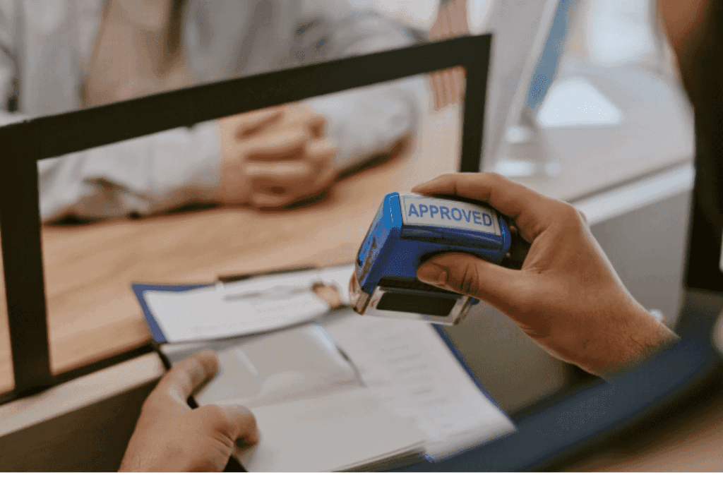 Close-up of 'APPROVED' stamp on a successful Skilled Worker Visa application.