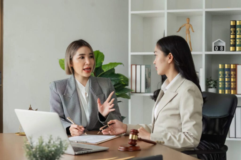 (Lawyers or consultants discussing unspent conviction case.)