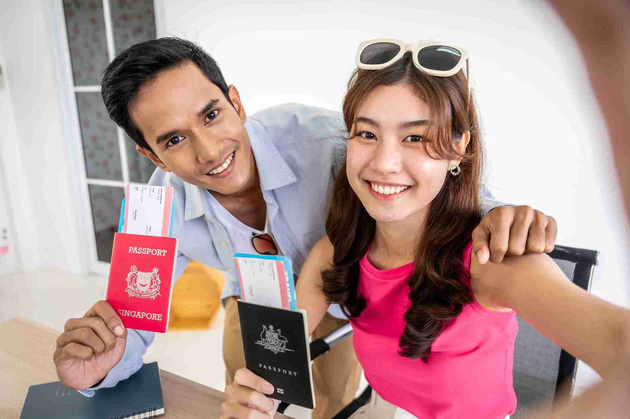 Couple holding passport ready for exiciting travel.