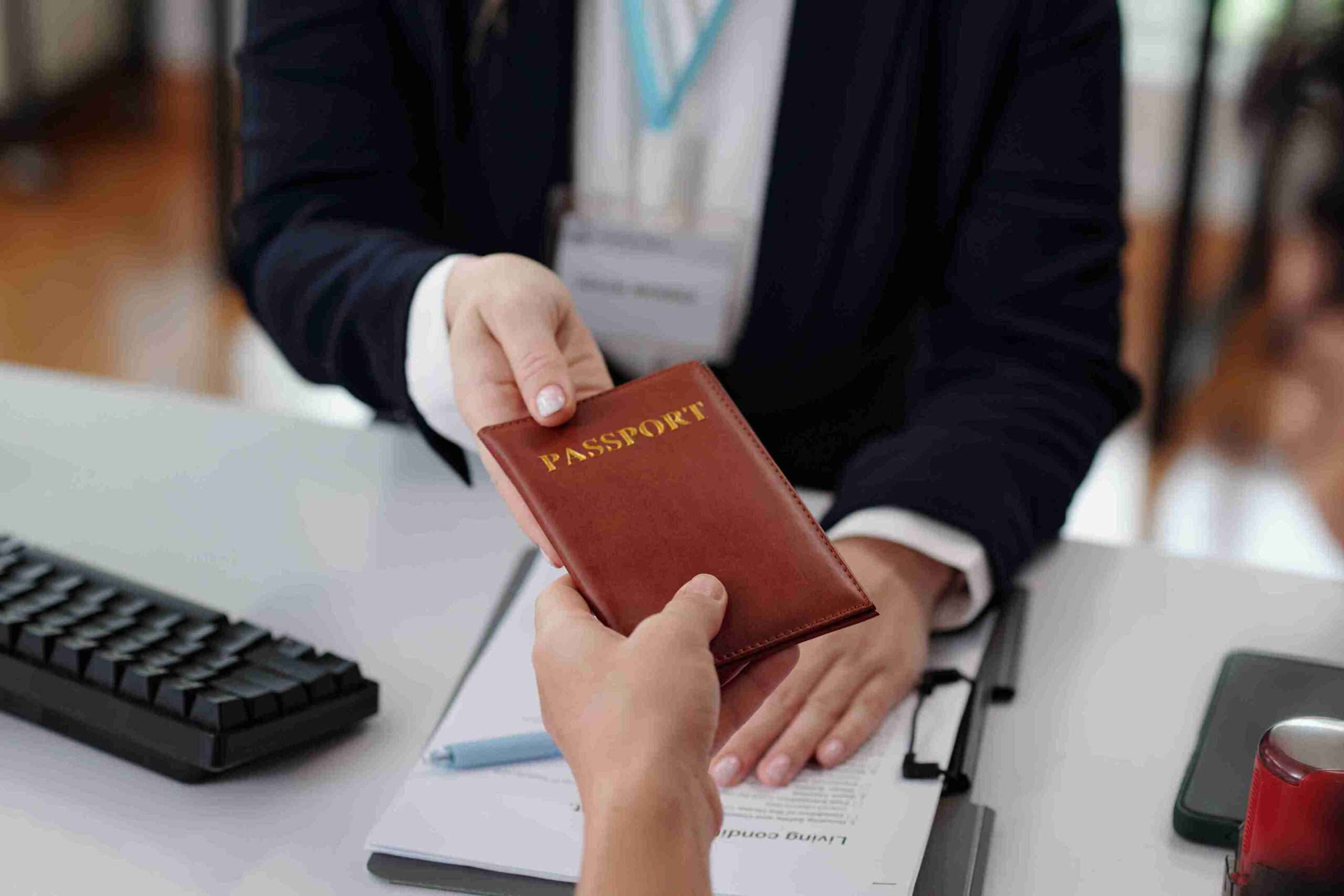 A Consultant handover the passport.