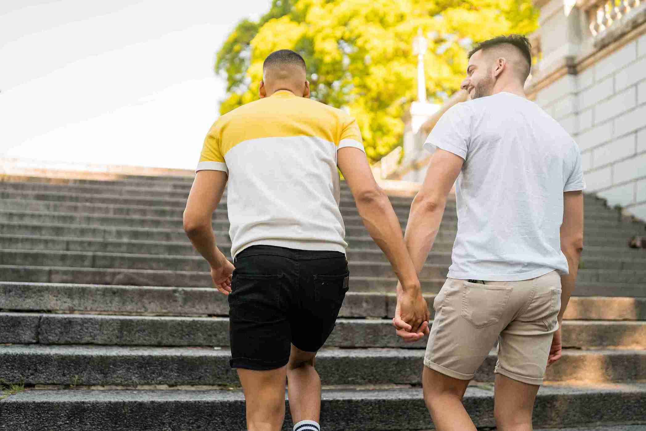 Romantic couple walking together up the stairs.