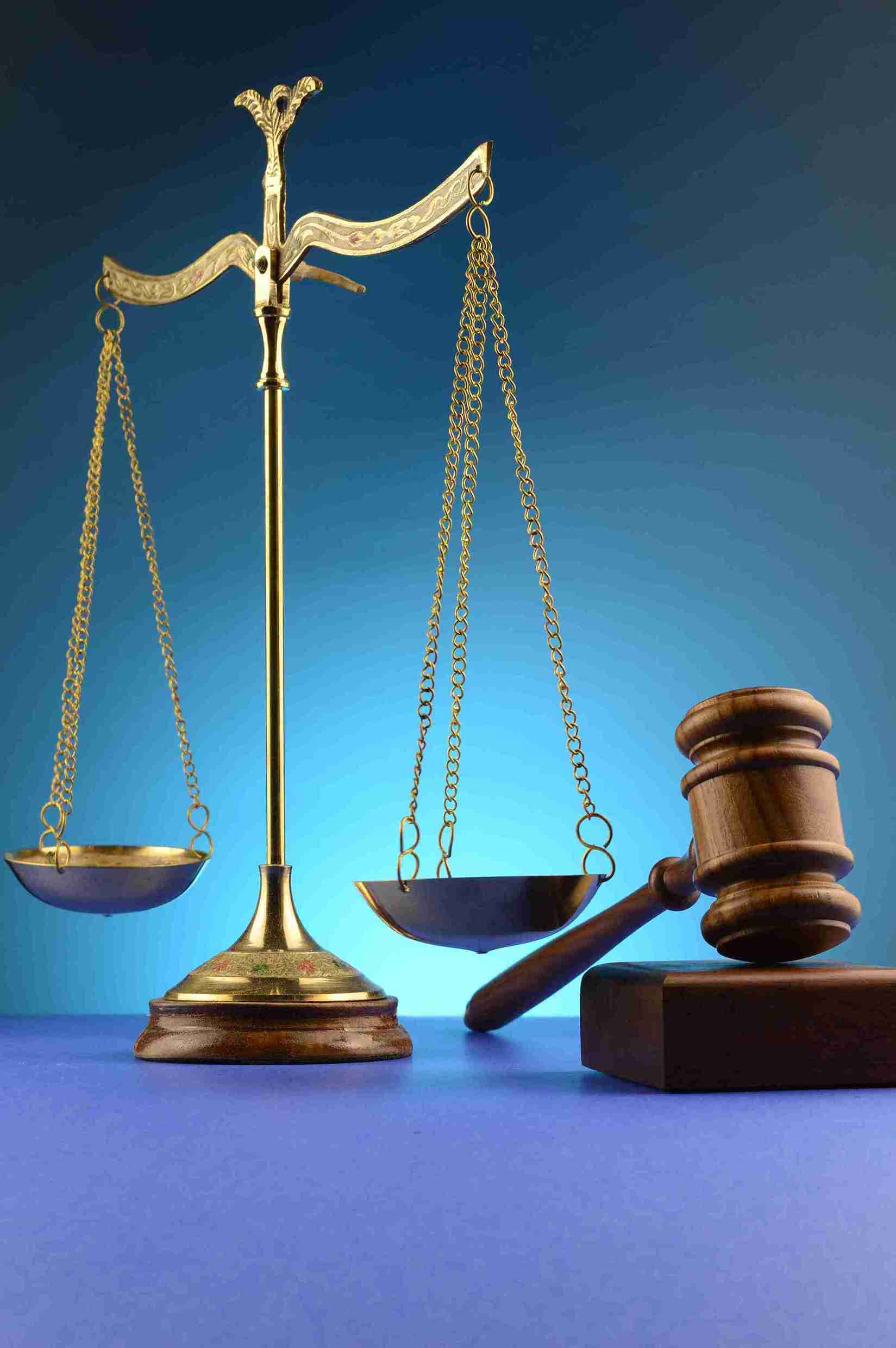 A gavel resting on a legal book, symbolizing the authority and principles of law in society.